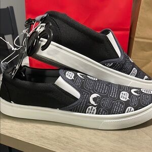 Vans Black and White Slip-On Sneakers
